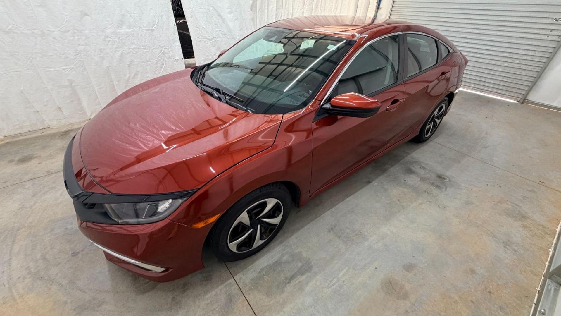 2021 Red Honda Civic Sedan LX (2HGFC2F64MH) with an 2L I-4 DOHC engine, located at 1806 Veterans Memorial Hwy SW, Austell, GA, 30168, (770) 944-9558, 33.817959, -84.606987 - This Honda is in great condition, with paint that looks good and tires that look clean and brand new. Inside, the interior looks impeccable. A reliable, fuel-efficient compact that's ready for daily driving.- Photo#1