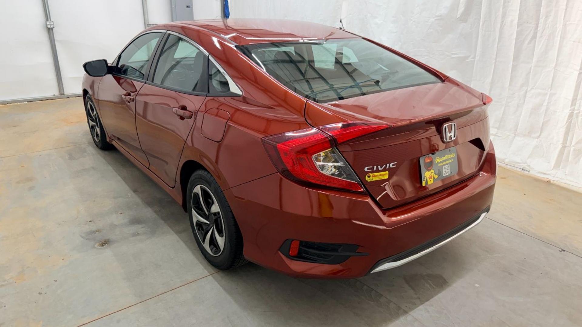 2021 Red Honda Civic Sedan LX (2HGFC2F64MH) with an 2L I-4 DOHC engine, located at 1806 Veterans Memorial Hwy SW, Austell, GA, 30168, (770) 944-9558, 33.817959, -84.606987 - This Honda is in great condition, with paint that looks good and tires that look clean and brand new. Inside, the interior looks impeccable. A reliable, fuel-efficient compact that's ready for daily driving.- Photo#3
