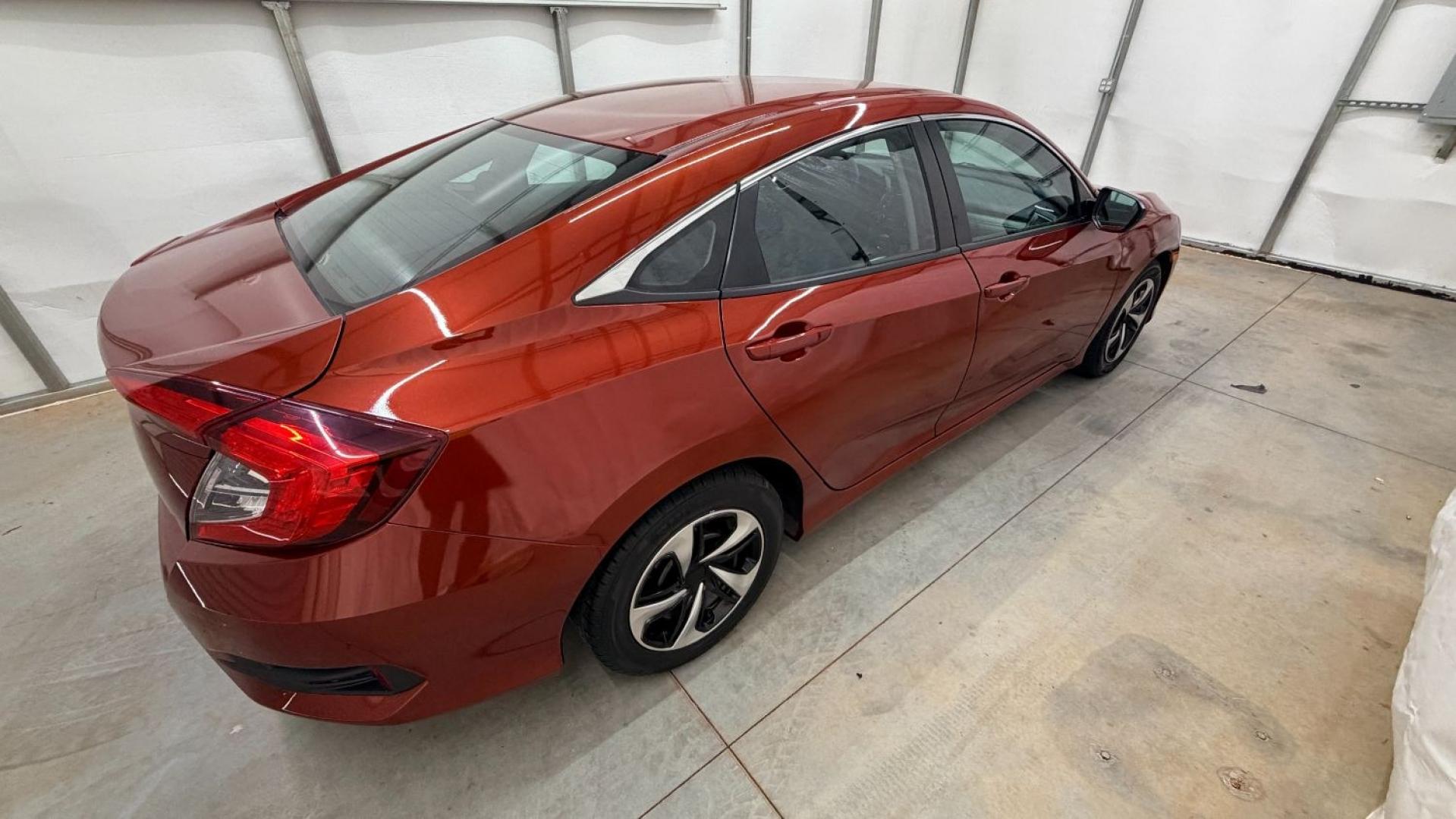 2021 Red Honda Civic Sedan LX (2HGFC2F64MH) with an 2L I-4 DOHC engine, located at 1806 Veterans Memorial Hwy SW, Austell, GA, 30168, (770) 944-9558, 33.817959, -84.606987 - This Honda is in great condition, with paint that looks good and tires that look clean and brand new. Inside, the interior looks impeccable. A reliable, fuel-efficient compact that's ready for daily driving.- Photo#6