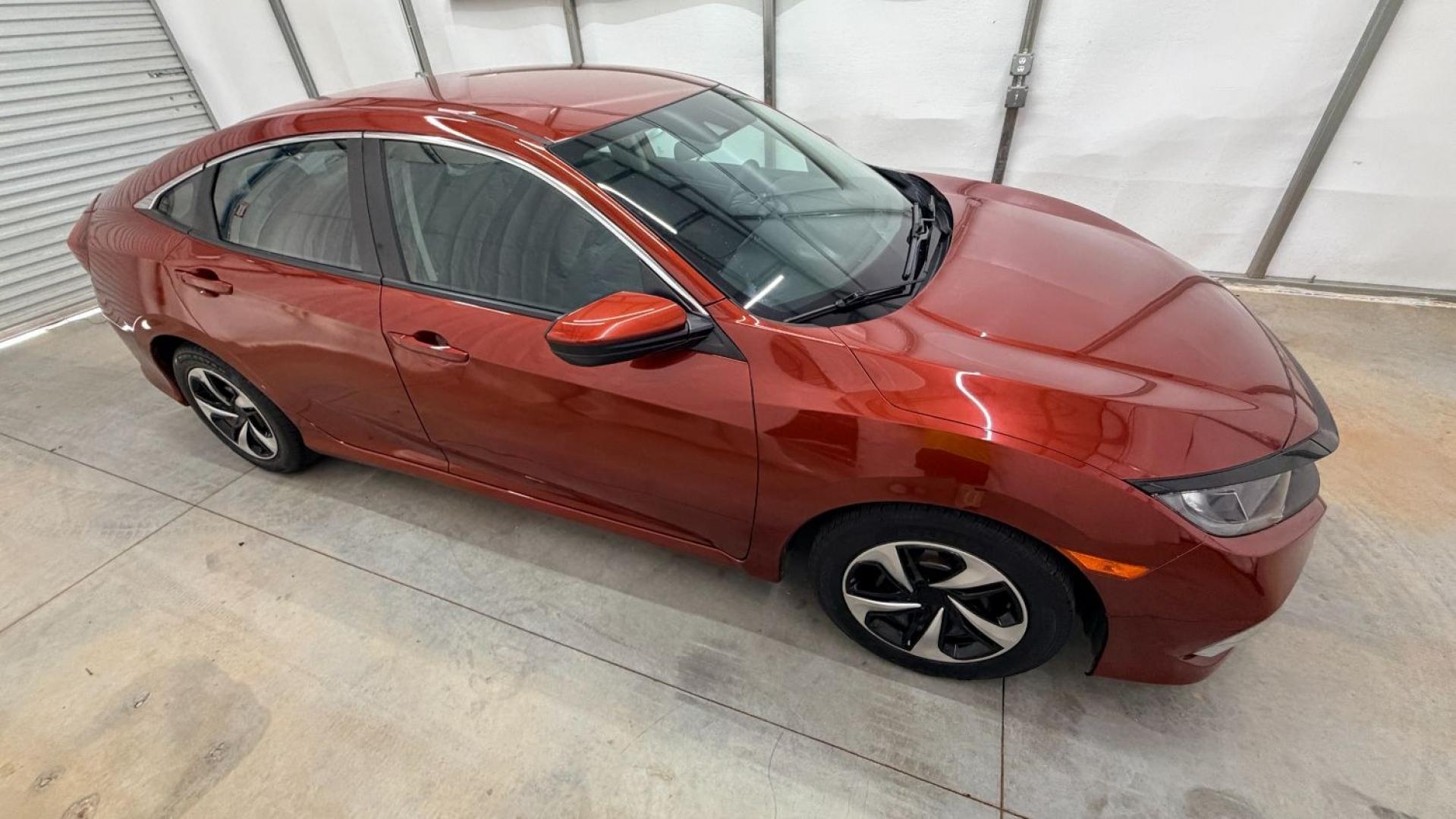 2021 Red Honda Civic Sedan LX (2HGFC2F64MH) with an 2L I-4 DOHC engine, located at 1806 Veterans Memorial Hwy SW, Austell, GA, 30168, (770) 944-9558, 33.817959, -84.606987 - This Honda is in great condition, with paint that looks good and tires that look clean and brand new. Inside, the interior looks impeccable. A reliable, fuel-efficient compact that's ready for daily driving.- Photo#7