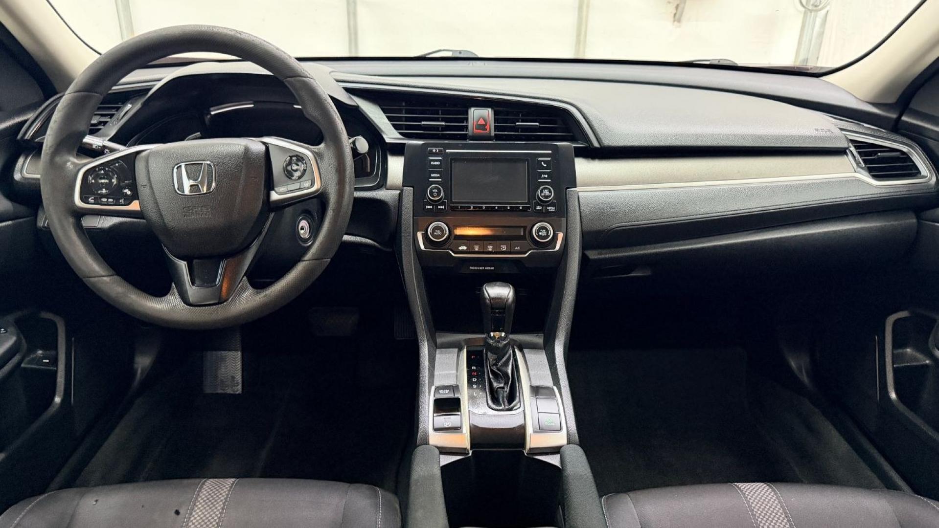 2021 Red Honda Civic Sedan LX (2HGFC2F64MH) with an 2L I-4 DOHC engine, located at 1806 Veterans Memorial Hwy SW, Austell, GA, 30168, (770) 944-9558, 33.817959, -84.606987 - This Honda is in great condition, with paint that looks good and tires that look clean and brand new. Inside, the interior looks impeccable. A reliable, fuel-efficient compact that's ready for daily driving.- Photo#14