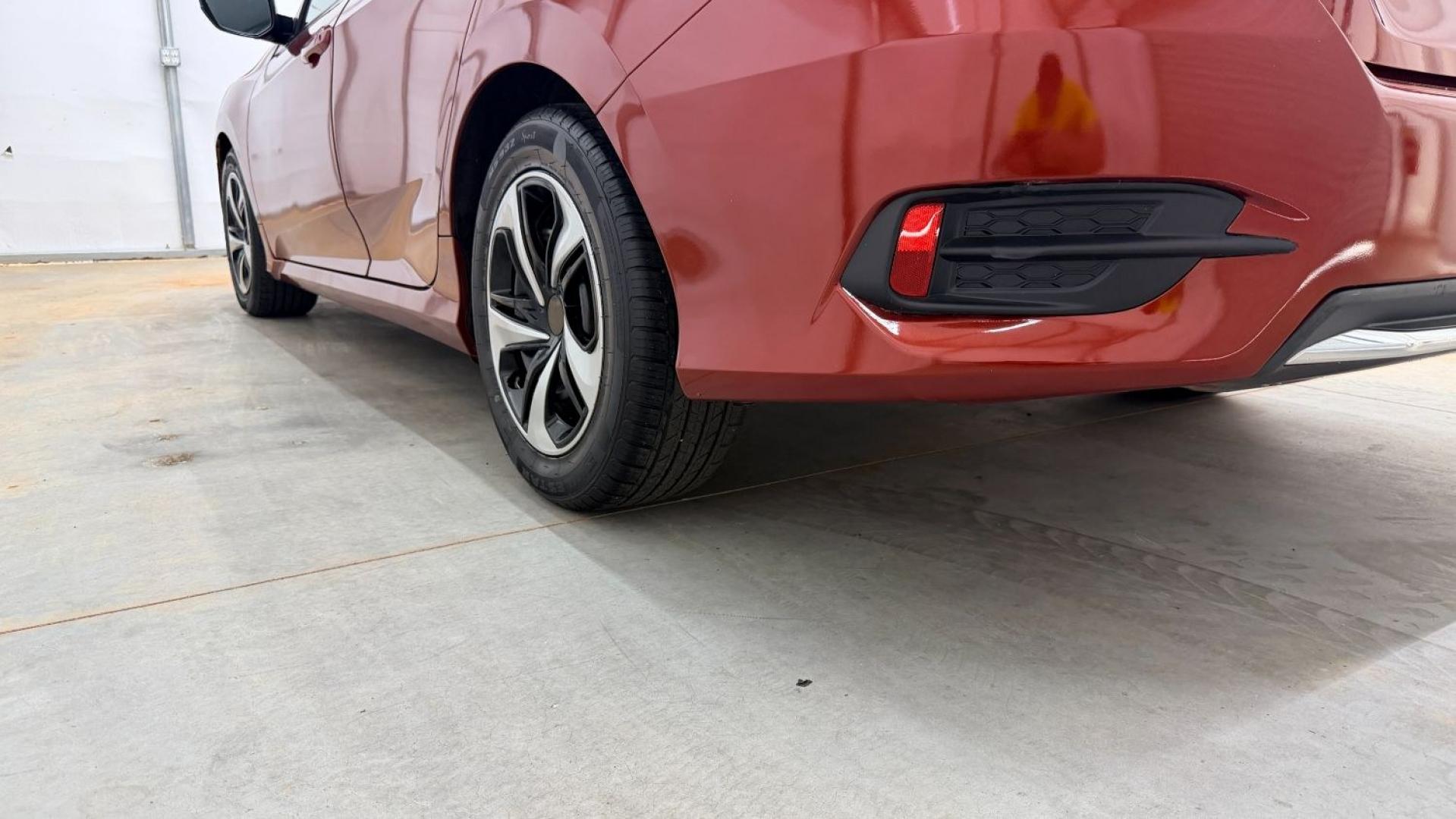 2021 Red Honda Civic Sedan LX (2HGFC2F64MH) with an 2L I-4 DOHC engine, located at 1806 Veterans Memorial Hwy SW, Austell, GA, 30168, (770) 944-9558, 33.817959, -84.606987 - This Honda is in great condition, with paint that looks good and tires that look clean and brand new. Inside, the interior looks impeccable. A reliable, fuel-efficient compact that's ready for daily driving.- Photo#21