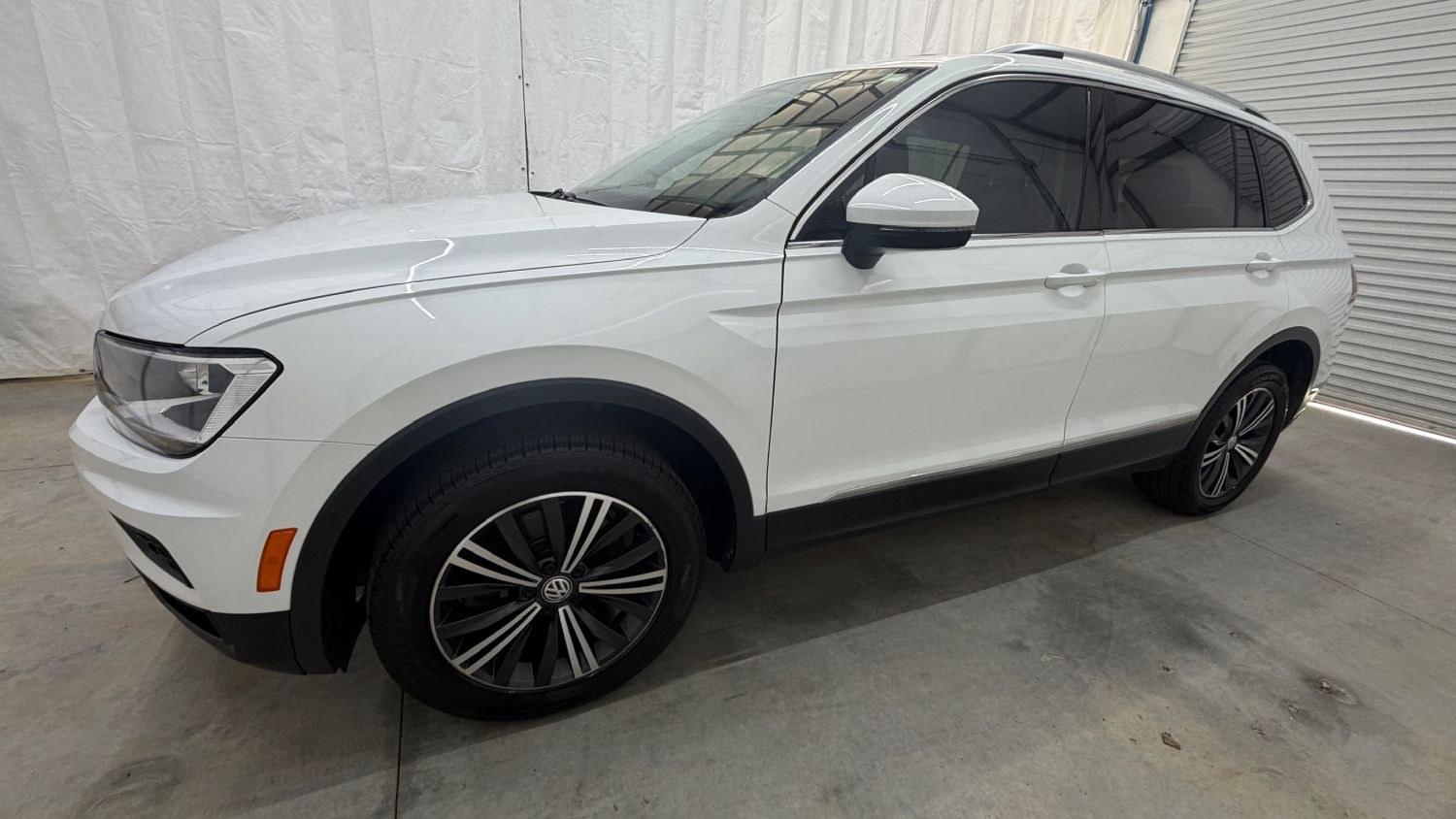 2018 White Volkswagen Tiguan 2.0T SEL | 2.0T SE (3VV2B7AX5JM) with an 2L I-4 direct injection engine, located at 1806 Veterans Memorial Hwy SW, Austell, GA, 30168, (770) 944-9558, 33.817959, -84.606987 - This 2018 Volkswagen Tiguan SEL has passed a 100+ point inspection performed in our own service center. It's in like-new condition and even smells like new, with no blemishes inside or out to describe. It also has new tires. Come see it in person and take it for a test drive! Why Choose Automania?- Photo#1