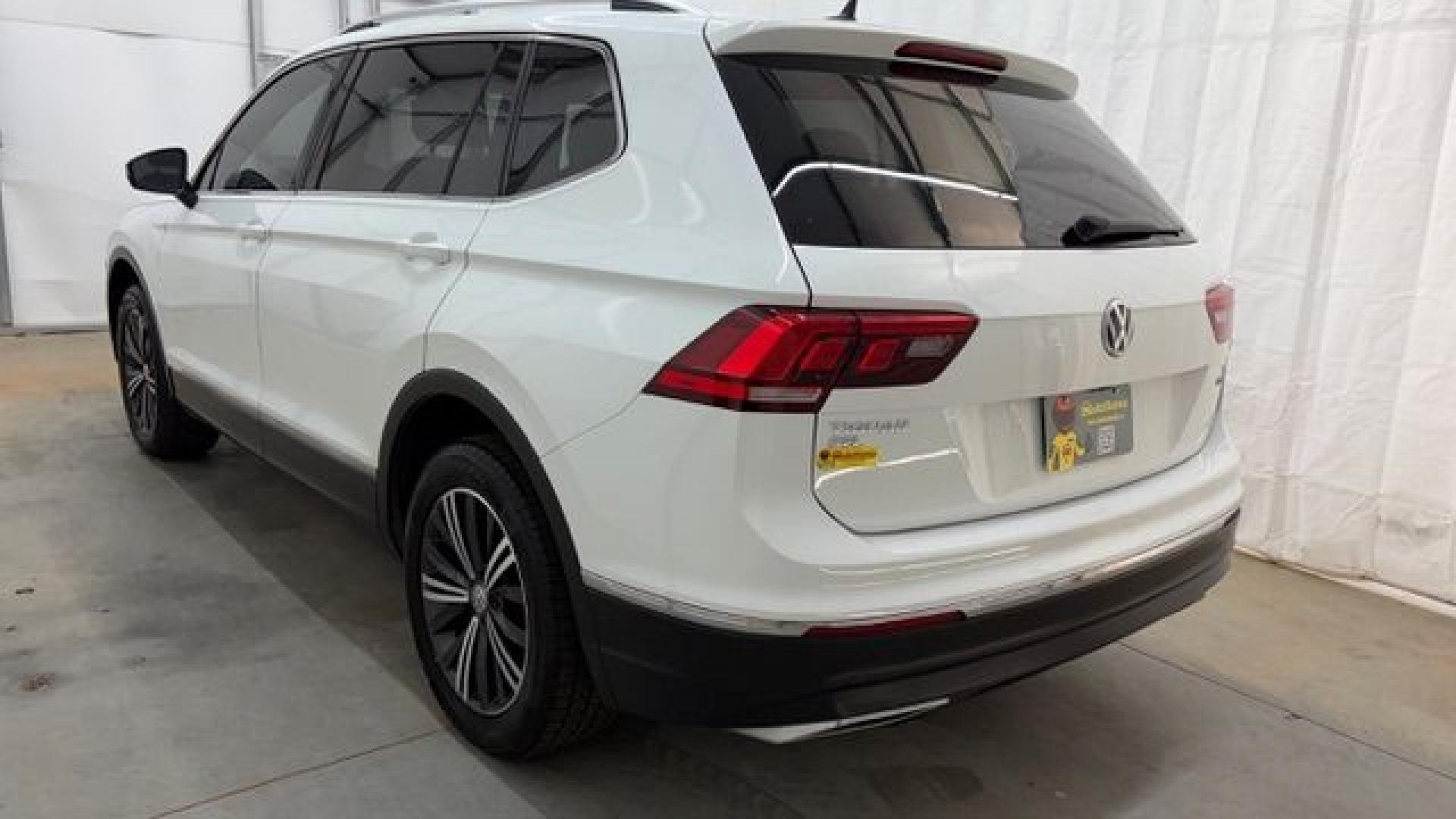 2018 White Volkswagen Tiguan 2.0T SEL | 2.0T SE (3VV2B7AX5JM) with an 2L I-4 direct injection engine, located at 1806 Veterans Memorial Hwy SW, Austell, GA, 30168, (770) 944-9558, 33.817959, -84.606987 - This 2018 Volkswagen Tiguan SEL has passed a 100+ point inspection performed in our own service center. It's in like-new condition and even smells like new, with no blemishes inside or out to describe. It also has new tires. Come see it in person and take it for a test drive! Why Choose Automania?- Photo#3