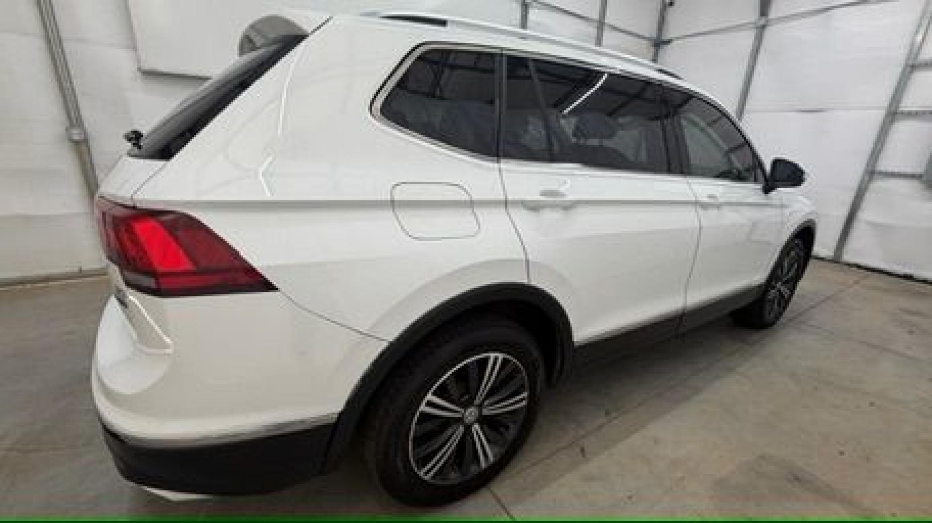 2018 White Volkswagen Tiguan 2.0T SEL | 2.0T SE (3VV2B7AX5JM) with an 2L I-4 direct injection engine, located at 1806 Veterans Memorial Hwy SW, Austell, GA, 30168, (770) 944-9558, 33.817959, -84.606987 - This 2018 Volkswagen Tiguan SEL has passed a 100+ point inspection performed in our own service center. It's in like-new condition and even smells like new, with no blemishes inside or out to describe. It also has new tires. Come see it in person and take it for a test drive! Why Choose Automania?- Photo#6