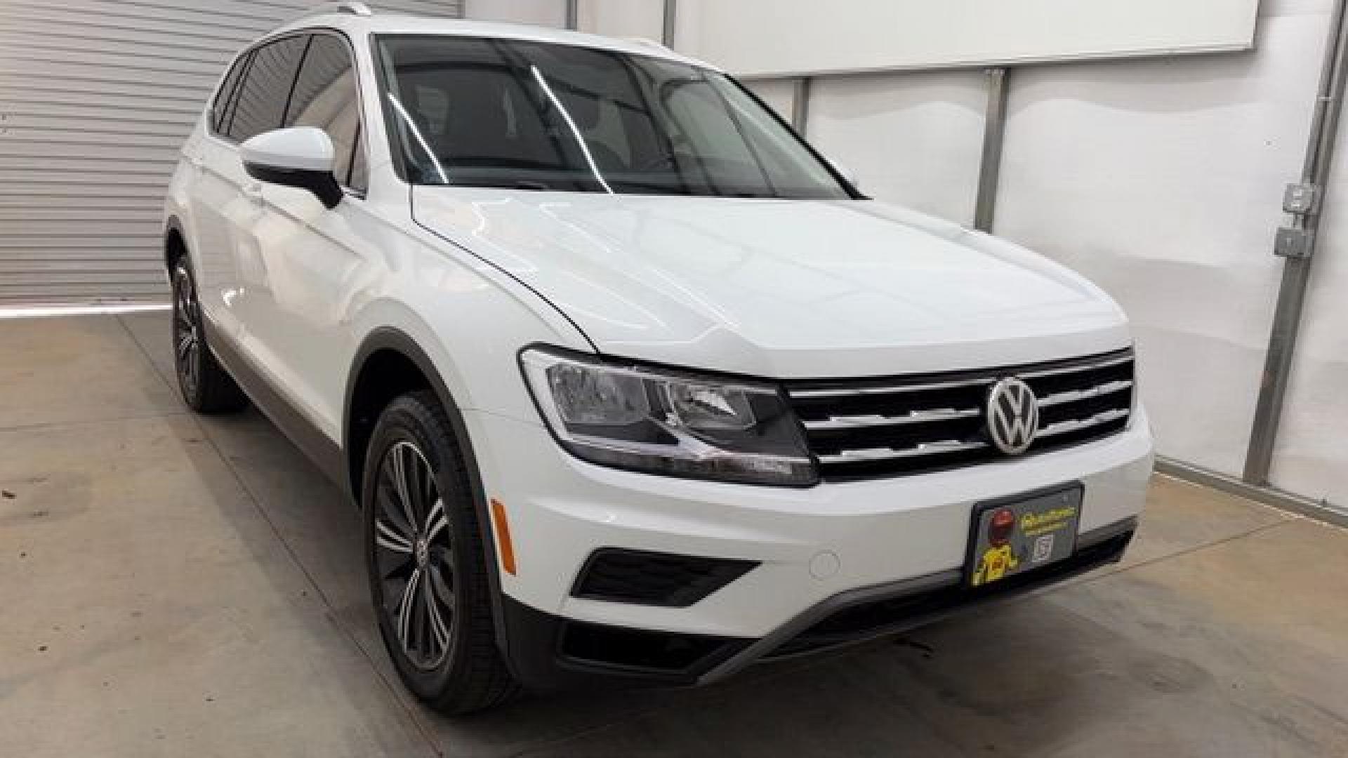 2018 White Volkswagen Tiguan 2.0T SEL | 2.0T SE (3VV2B7AX5JM) with an 2L I-4 direct injection engine, located at 1806 Veterans Memorial Hwy SW, Austell, GA, 30168, (770) 944-9558, 33.817959, -84.606987 - This 2018 Volkswagen Tiguan SEL has passed a 100+ point inspection performed in our own service center. It's in like-new condition and even smells like new, with no blemishes inside or out to describe. It also has new tires. Come see it in person and take it for a test drive! Why Choose Automania?- Photo#8