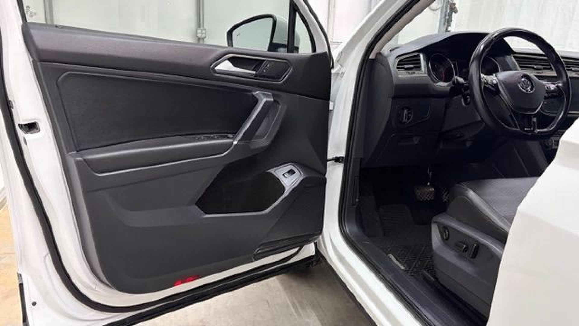 2018 White Volkswagen Tiguan 2.0T SEL | 2.0T SE (3VV2B7AX5JM) with an 2L I-4 direct injection engine, located at 1806 Veterans Memorial Hwy SW, Austell, GA, 30168, (770) 944-9558, 33.817959, -84.606987 - This 2018 Volkswagen Tiguan SEL has passed a 100+ point inspection performed in our own service center. It's in like-new condition and even smells like new, with no blemishes inside or out to describe. It also has new tires. Come see it in person and take it for a test drive! Why Choose Automania?- Photo#10