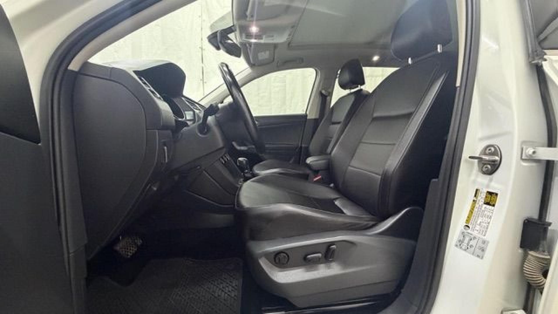 2018 White Volkswagen Tiguan 2.0T SEL | 2.0T SE (3VV2B7AX5JM) with an 2L I-4 direct injection engine, located at 1806 Veterans Memorial Hwy SW, Austell, GA, 30168, (770) 944-9558, 33.817959, -84.606987 - This 2018 Volkswagen Tiguan SEL has passed a 100+ point inspection performed in our own service center. It's in like-new condition and even smells like new, with no blemishes inside or out to describe. It also has new tires. Come see it in person and take it for a test drive! Why Choose Automania?- Photo#12