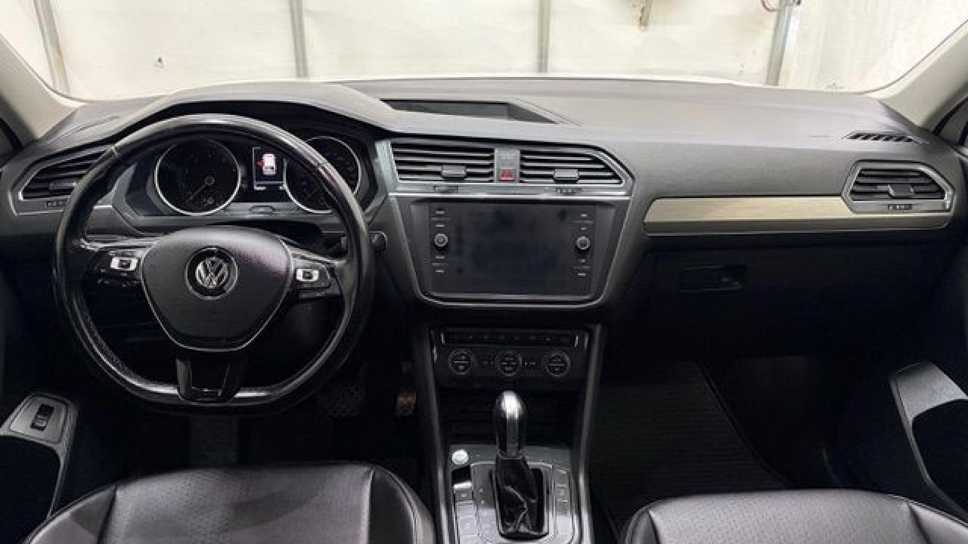 2018 White Volkswagen Tiguan 2.0T SEL | 2.0T SE (3VV2B7AX5JM) with an 2L I-4 direct injection engine, located at 1806 Veterans Memorial Hwy SW, Austell, GA, 30168, (770) 944-9558, 33.817959, -84.606987 - This 2018 Volkswagen Tiguan SEL has passed a 100+ point inspection performed in our own service center. It's in like-new condition and even smells like new, with no blemishes inside or out to describe. It also has new tires. Come see it in person and take it for a test drive! Why Choose Automania?- Photo#15