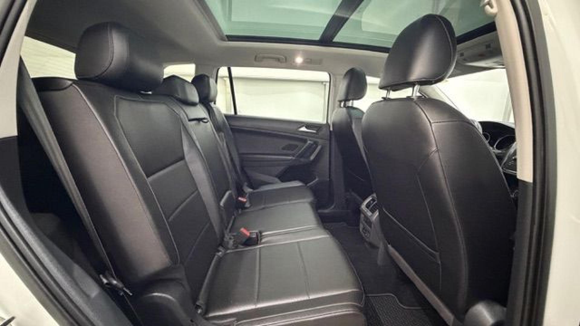 2018 White Volkswagen Tiguan 2.0T SEL | 2.0T SE (3VV2B7AX5JM) with an 2L I-4 direct injection engine, located at 1806 Veterans Memorial Hwy SW, Austell, GA, 30168, (770) 944-9558, 33.817959, -84.606987 - This 2018 Volkswagen Tiguan SEL has passed a 100+ point inspection performed in our own service center. It's in like-new condition and even smells like new, with no blemishes inside or out to describe. It also has new tires. Come see it in person and take it for a test drive! Why Choose Automania?- Photo#17