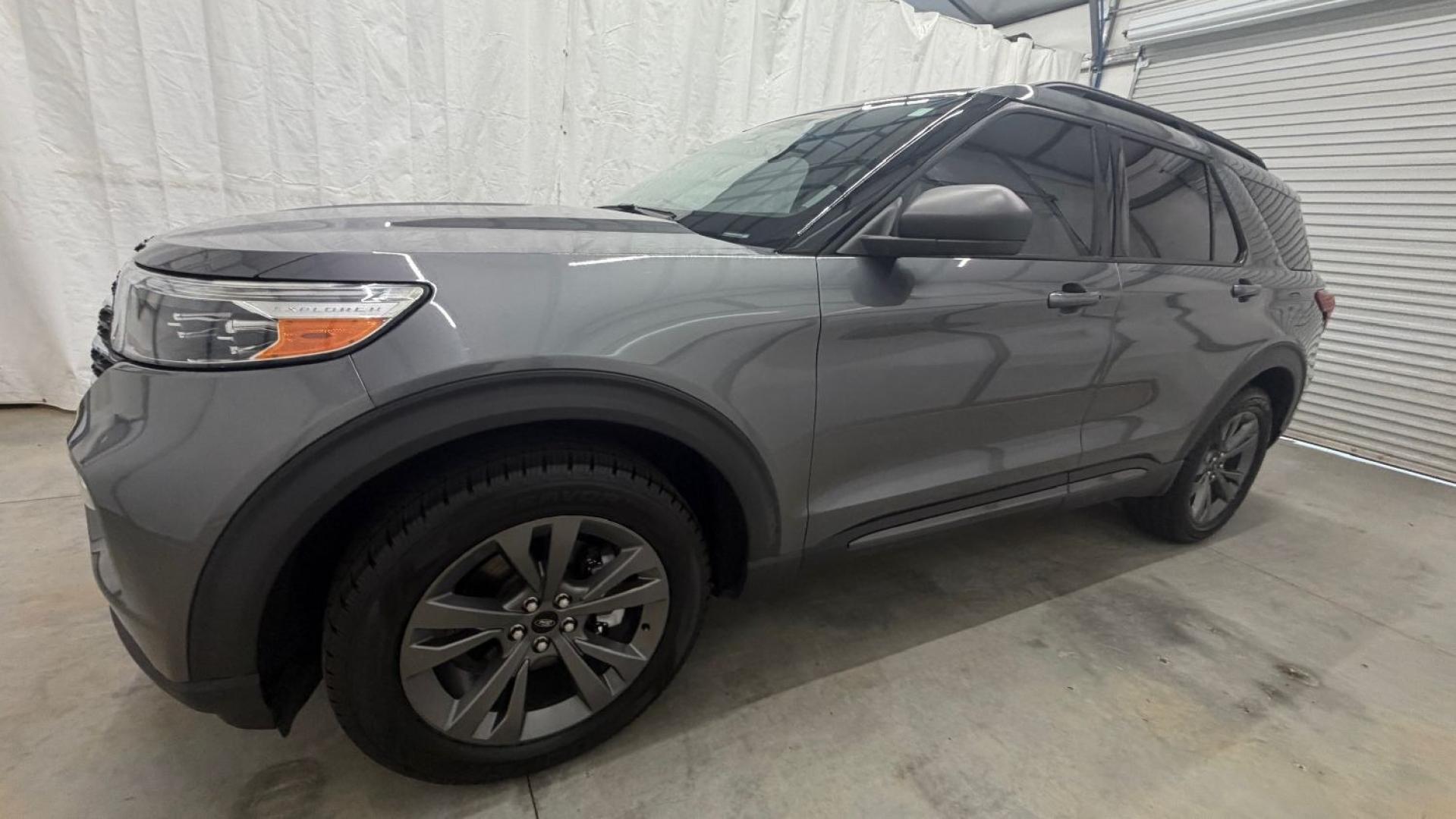 2021 Gray Ford Explorer XLT (1FMSK8DHXMG) with an EcoBoost 2.3L I-4 direct injection engine, located at 1806 Veterans Memorial Hwy SW, Austell, GA, 30168, (770) 944-9558, 33.817959, -84.606987 - This Explorer has an interior that looks good and comes from a non-smoker vehicle. The exterior paint looks excellent, with only minor scratches, and the tires are in great shape. With lots of comfortable seating, it's a spacious, family-friendly SUV that's ready for daily driving.- Photo#1