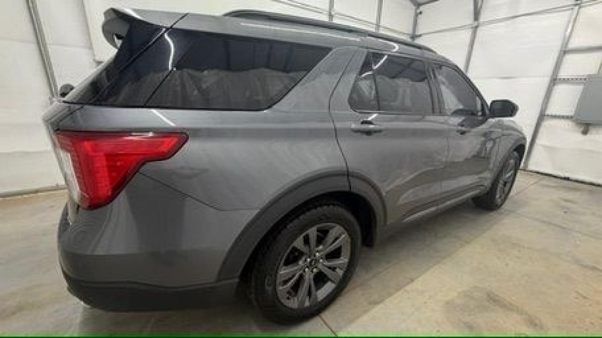 2021 Gray Ford Explorer XLT (1FMSK8DHXMG) with an EcoBoost 2.3L I-4 direct injection engine, located at 1806 Veterans Memorial Hwy SW, Austell, GA, 30168, (770) 944-9558, 33.817959, -84.606987 - This Explorer has an interior that looks good and comes from a non-smoker vehicle. The exterior paint looks excellent, with only minor scratches, and the tires are in great shape. With lots of comfortable seating, it's a spacious, family-friendly SUV that's ready for daily driving.- Photo#6