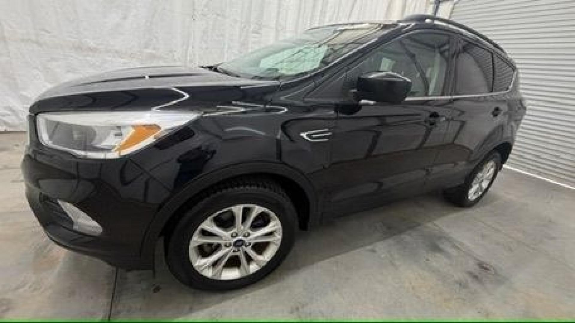 2018 Black Ford Escape SE (1FMCU9GD2JU) with an EcoBoost 1.5L I-4 direct injection engine, located at 1806 Veterans Memorial Hwy SW, Austell, GA, 30168, (770) 944-9558, 33.817959, -84.606987- Photo#1