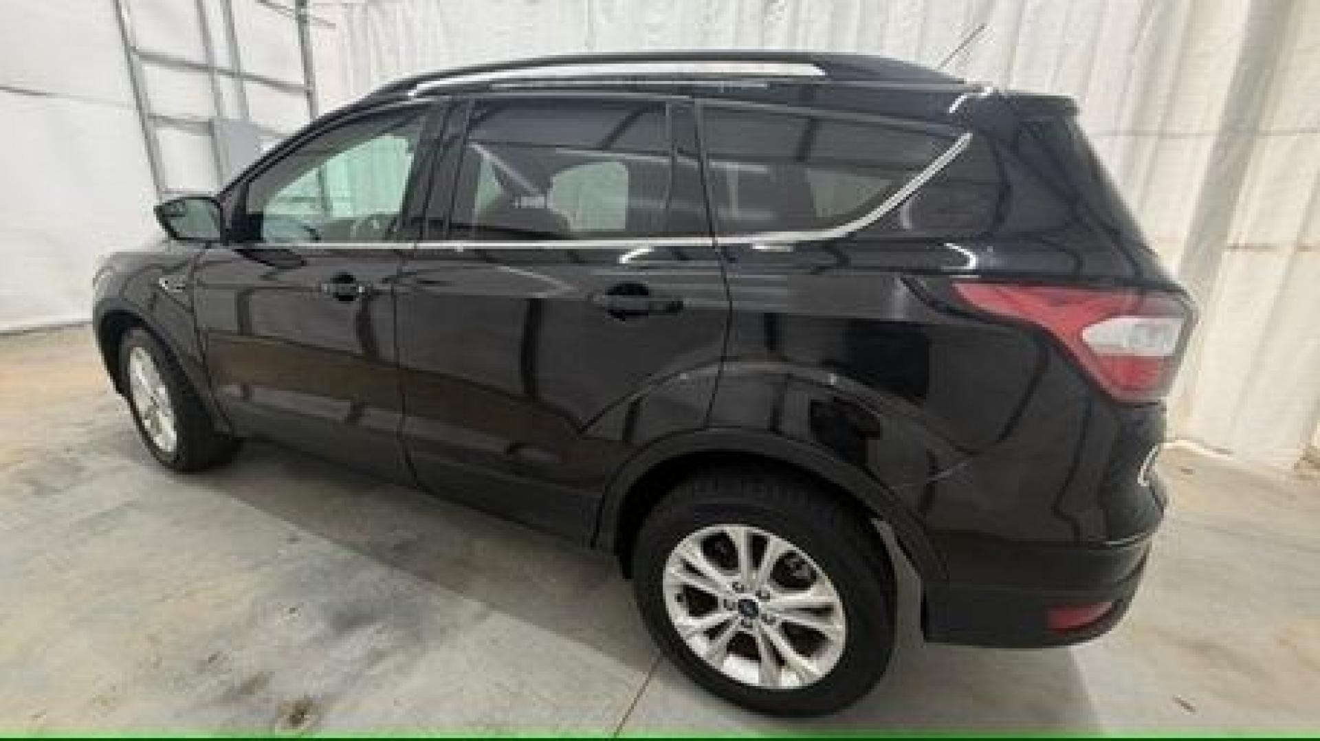 2018 Black Ford Escape SE (1FMCU9GD2JU) with an EcoBoost 1.5L I-4 direct injection engine, located at 1806 Veterans Memorial Hwy SW, Austell, GA, 30168, (770) 944-9558, 33.817959, -84.606987- Photo#2
