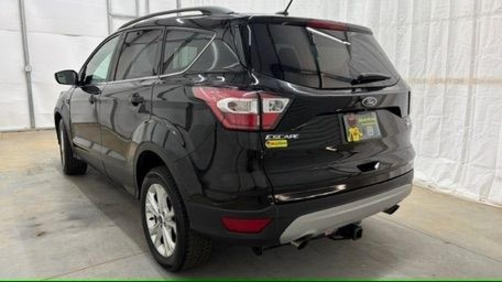 2018 Black Ford Escape SE (1FMCU9GD2JU) with an EcoBoost 1.5L I-4 direct injection engine, located at 1806 Veterans Memorial Hwy SW, Austell, GA, 30168, (770) 944-9558, 33.817959, -84.606987- Photo#3