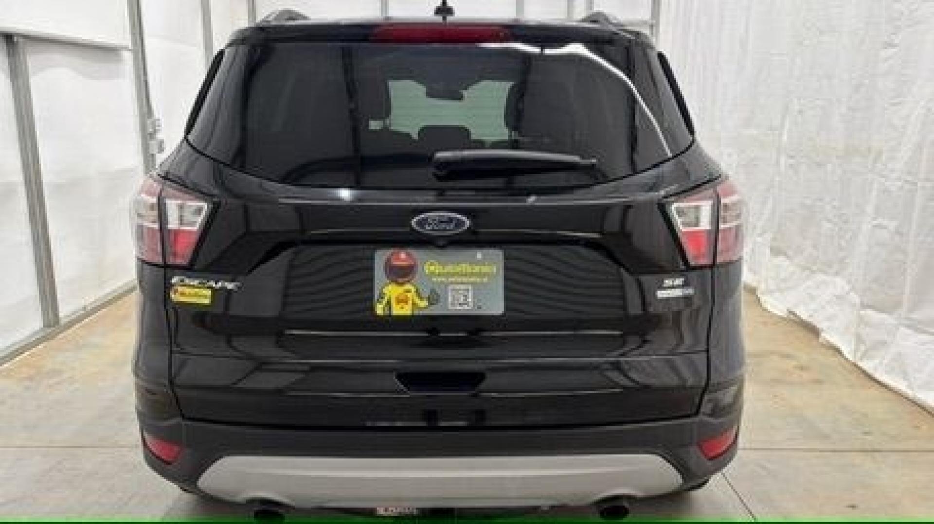 2018 Black Ford Escape SE (1FMCU9GD2JU) with an EcoBoost 1.5L I-4 direct injection engine, located at 1806 Veterans Memorial Hwy SW, Austell, GA, 30168, (770) 944-9558, 33.817959, -84.606987- Photo#4