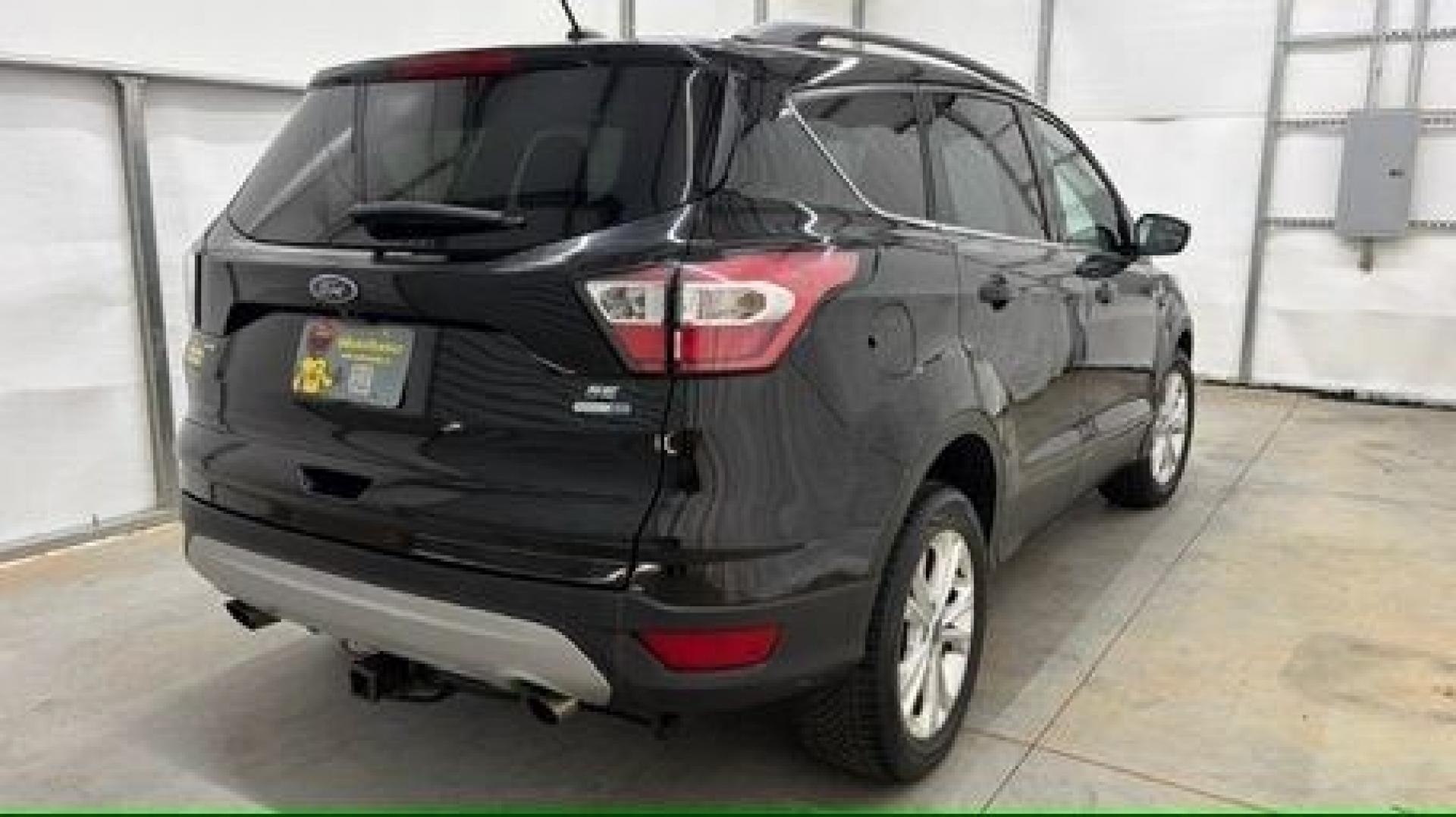 2018 Black Ford Escape SE (1FMCU9GD2JU) with an EcoBoost 1.5L I-4 direct injection engine, located at 1806 Veterans Memorial Hwy SW, Austell, GA, 30168, (770) 944-9558, 33.817959, -84.606987- Photo#5