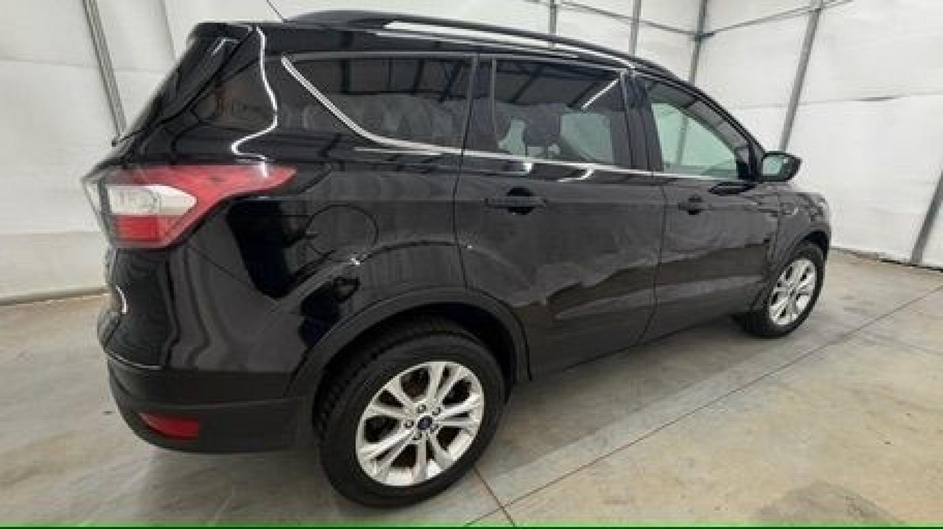 2018 Black Ford Escape SE (1FMCU9GD2JU) with an EcoBoost 1.5L I-4 direct injection engine, located at 1806 Veterans Memorial Hwy SW, Austell, GA, 30168, (770) 944-9558, 33.817959, -84.606987- Photo#6