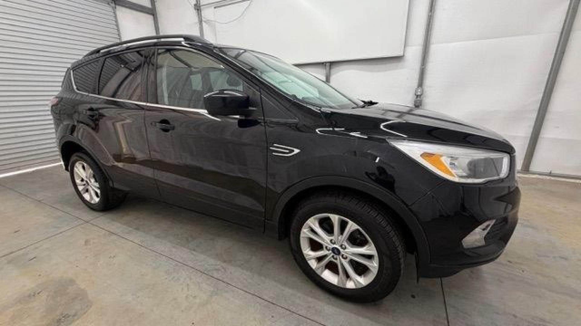 2018 Black Ford Escape SE (1FMCU9GD2JU) with an EcoBoost 1.5L I-4 direct injection engine, located at 1806 Veterans Memorial Hwy SW, Austell, GA, 30168, (770) 944-9558, 33.817959, -84.606987- Photo#7