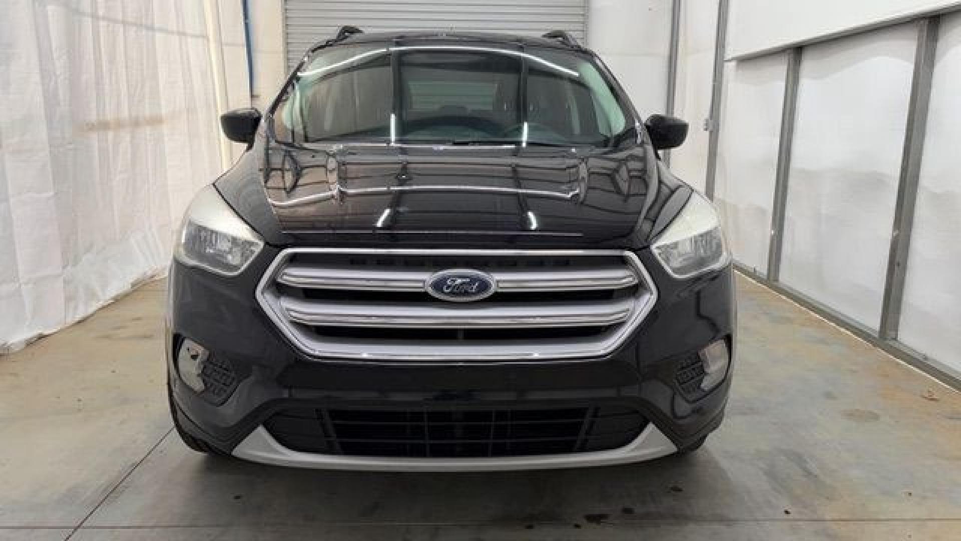 2018 Black Ford Escape SE (1FMCU9GD2JU) with an EcoBoost 1.5L I-4 direct injection engine, located at 1806 Veterans Memorial Hwy SW, Austell, GA, 30168, (770) 944-9558, 33.817959, -84.606987- Photo#8