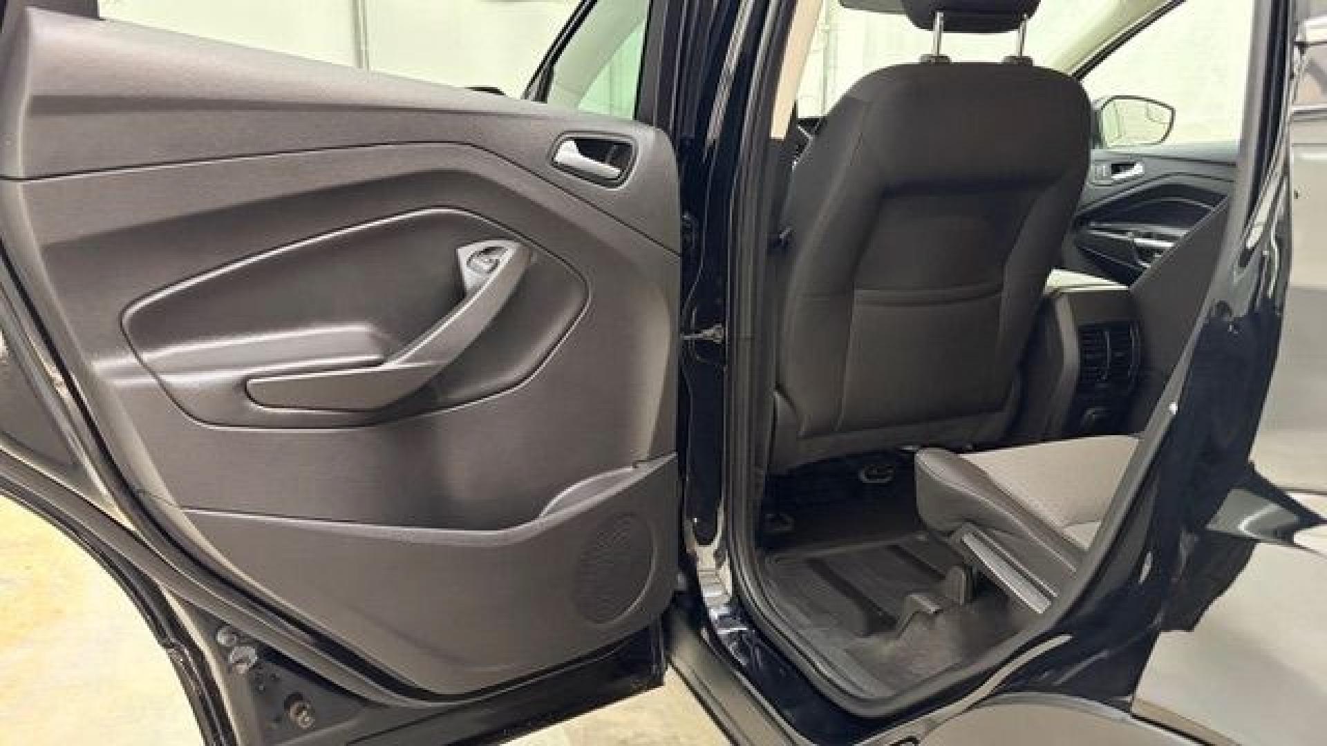 2018 Black Ford Escape SE (1FMCU9GD2JU) with an EcoBoost 1.5L I-4 direct injection engine, located at 1806 Veterans Memorial Hwy SW, Austell, GA, 30168, (770) 944-9558, 33.817959, -84.606987- Photo#12