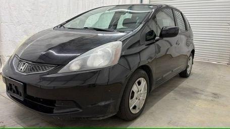 2013 Black /Gray Cloth Interior Honda Fit 5-Speed AT (JHMGE8H35DC) with an 1.5L L4 SOHC 16V engine, 5-Speed Automatic transmission, located at 1806 Veterans Memorial Hwy SW, Austell, GA, 30168, (770) 944-9558, 33.817959, -84.606987- Photo#0