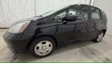 2013 Black /Gray Cloth Interior Honda Fit 5-Speed AT (JHMGE8H35DC) with an 1.5L L4 SOHC 16V engine, 5-Speed Automatic transmission, located at 1806 Veterans Memorial Hwy SW, Austell, GA, 30168, (770) 944-9558, 33.817959, -84.606987- Photo#1
