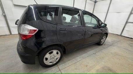 2013 Black /Gray Cloth Interior Honda Fit 5-Speed AT (JHMGE8H35DC) with an 1.5L L4 SOHC 16V engine, 5-Speed Automatic transmission, located at 1806 Veterans Memorial Hwy SW, Austell, GA, 30168, (770) 944-9558, 33.817959, -84.606987- Photo#6