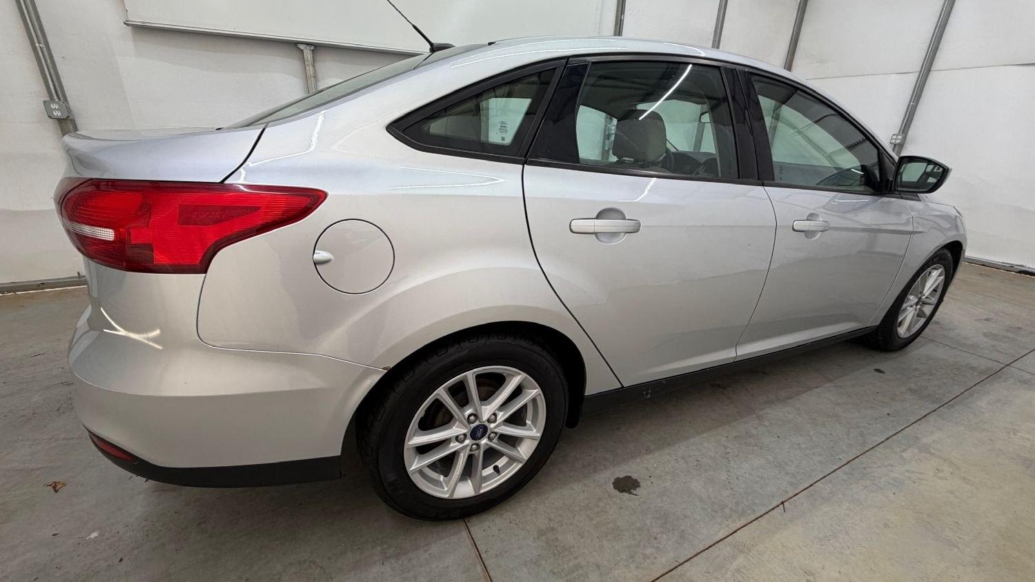 2018 Silver Ford Focus SE (1FADP3F23JL) , located at 1806 Veterans Memorial Hwy SW, Austell, GA, 30168, (770) 944-9558, 33.817959, -84.606987 - This Ford Focus SE has passed a 100+ point inspection performed in our own service center. It's very clean, with no issues to describe and no odors, and the tires are in great condition. Come see it in person and take it for a test drive! Why Choose Automania? At Automania, we make car buying easy- Photo#6