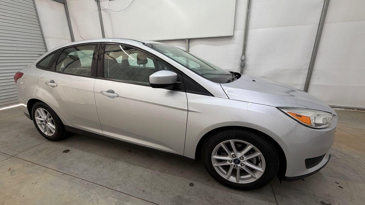2018 Silver Ford Focus SE (1FADP3F23JL) , located at 1806 Veterans Memorial Hwy SW, Austell, GA, 30168, (770) 944-9558, 33.817959, -84.606987 - This Ford Focus SE has passed a 100+ point inspection performed in our own service center. It's very clean, with no issues to describe and no odors, and the tires are in great condition. Come see it in person and take it for a test drive! Why Choose Automania? At Automania, we make car buying easy- Photo#7