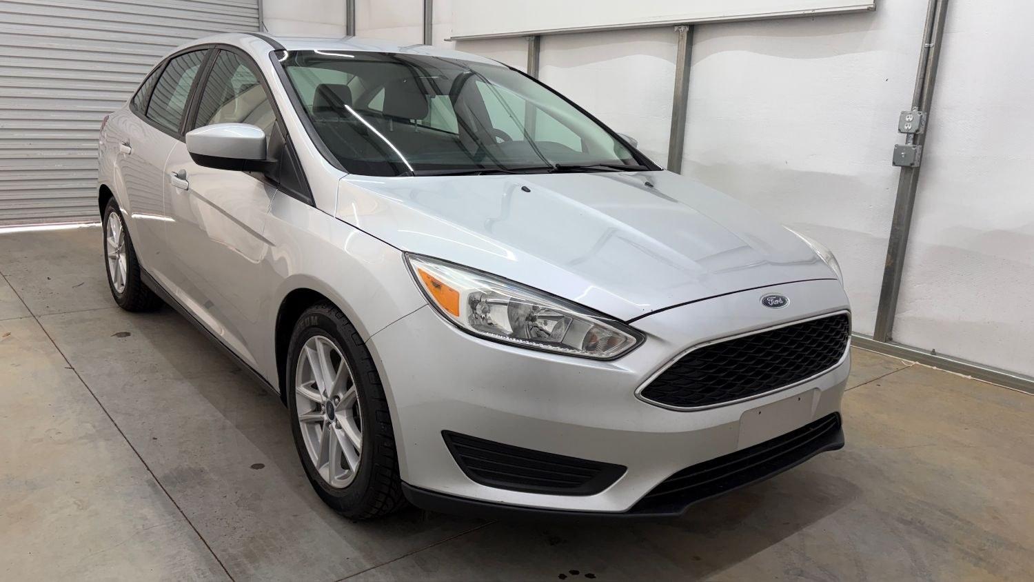 2018 Silver Ford Focus SE (1FADP3F23JL) , located at 1806 Veterans Memorial Hwy SW, Austell, GA, 30168, (770) 944-9558, 33.817959, -84.606987 - This Ford Focus SE has passed a 100+ point inspection performed in our own service center. It's very clean, with no issues to describe and no odors, and the tires are in great condition. Come see it in person and take it for a test drive! Why Choose Automania? At Automania, we make car buying easy- Photo#8